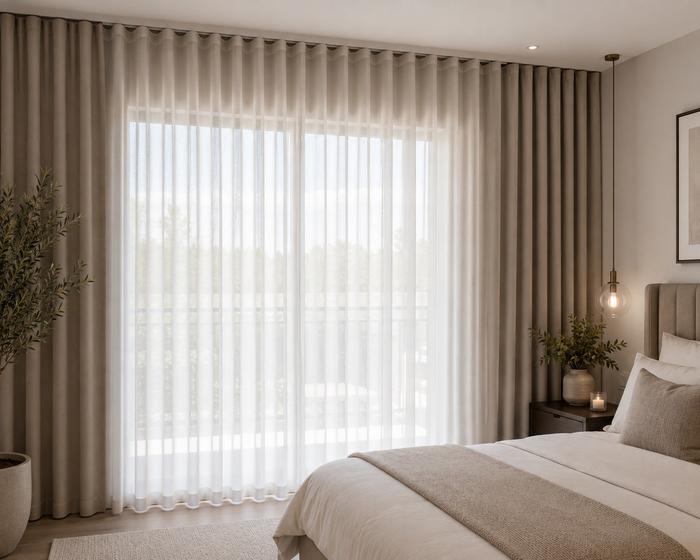 Sheer and blockout curtains layered together