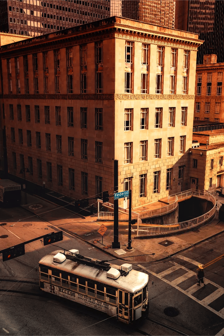 A high-angle view of the McKinney Avenue streetcar at golden hour in Dallas.