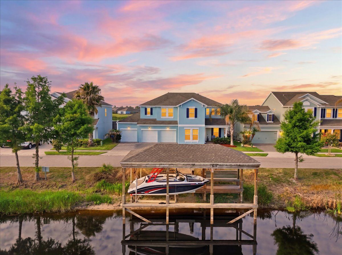Waterfront property with private dock and boat photographed by Magic Lens Photo Media in Central Florida