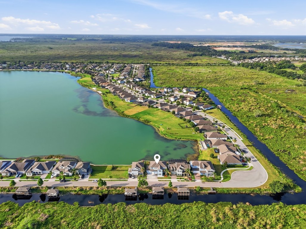 Aerial photograph highlighting a residential property with a location marker.
