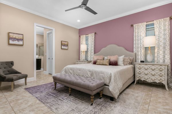 This ground floor bedroom features a beautiful king bed