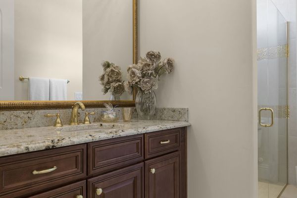 The en-suite bathroom has a walk-in shower built to match the suite