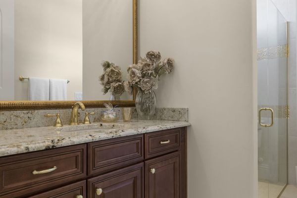 The en-suite bathroom has a walk-in shower built to match the suite