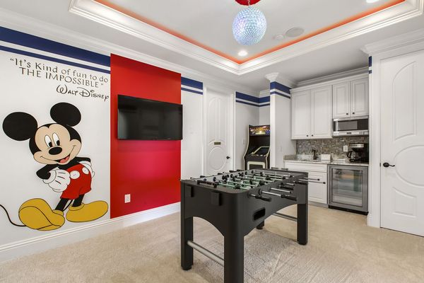 Fun third floor entertainment space with foosball table and arcade game