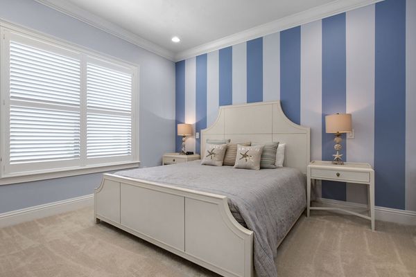 Vacation in the Destin Suite in this second floor bedroom with a king bed