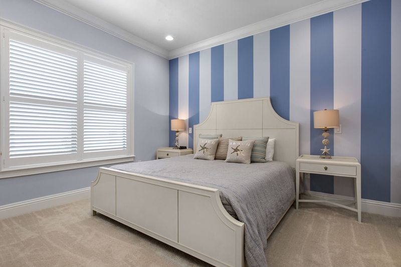 Vacation in the Destin Suite in this second floor bedroom with a king bed