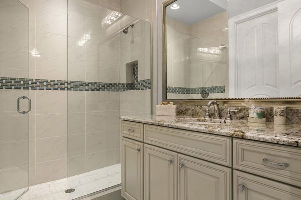 The en-suite bathroom has a walk-in shower built to match the suite