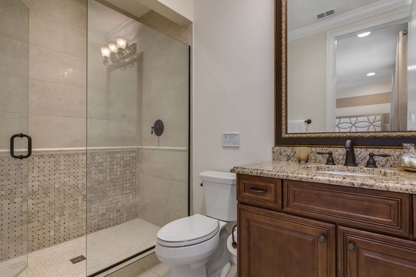 The en-suite bathroom has a walk-in shower