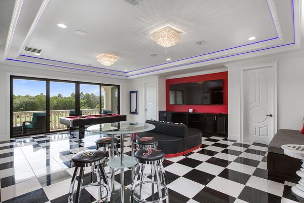 Gather in the sports bar themed games room to enjoy a round of pool or 6 TVs