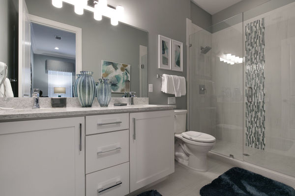 The master en-suite bathroom features a glass door walk in shower