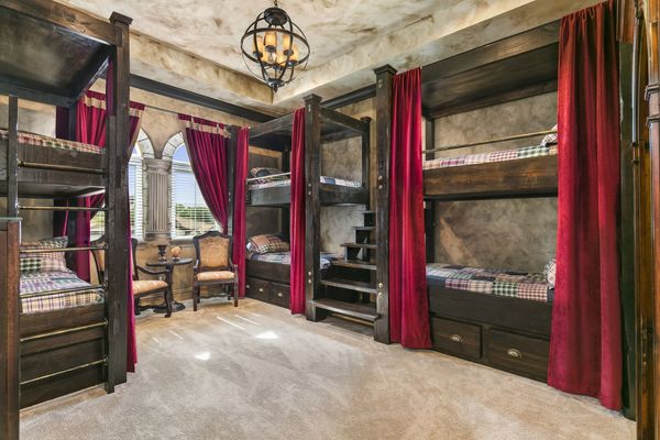 The Wizardy themed kid`s bedroom features custom built twin over twin bunk beds