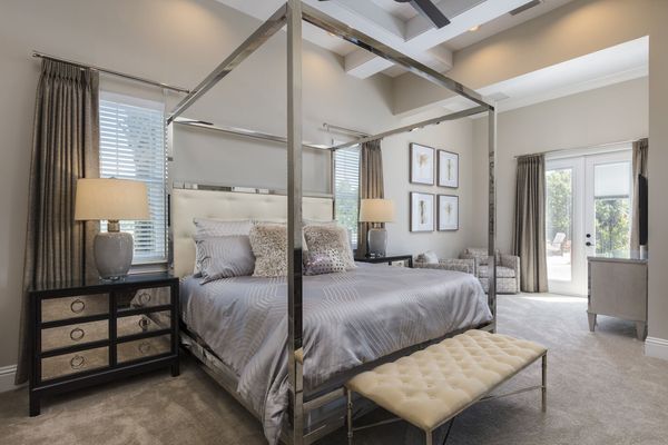 The master suite located on the first floor features a king size bed