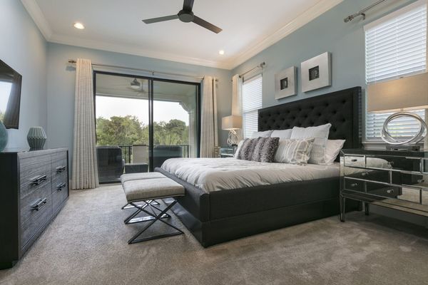 This master suite has a king bed, 50-inch SMART TV, and access to the patio balcony