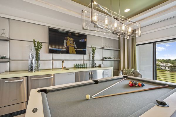 A convenient wet bar in the loft games area