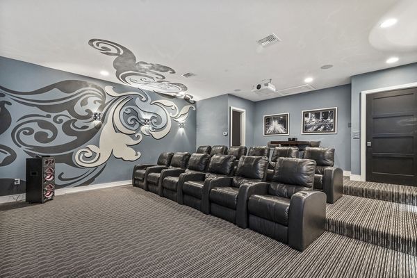 Recliner Seating for 13 and a wet bar in the back