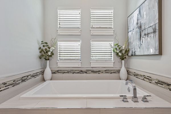 Features a large tub and walk in shower