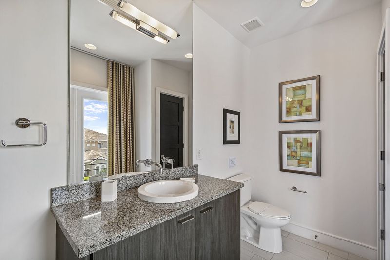 A half bathroom located on the third floor