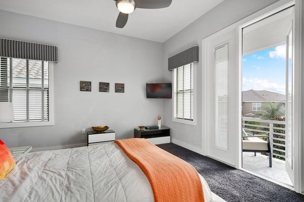 The bedroom also features a 32-inch TV and access to a private balcony