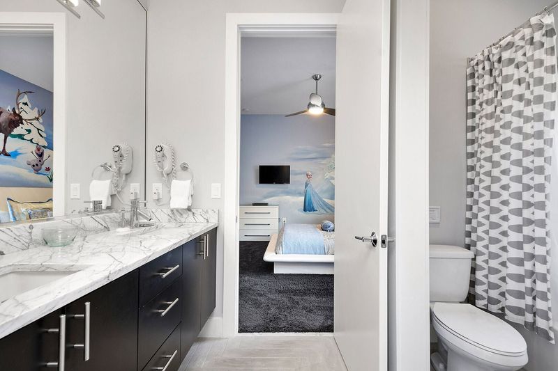 Bedroom 4 and 5 will share a full bathroom with marble dual vanity and shower/tub combo