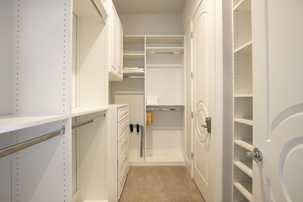 Spacious walk-in closet with built in shelfing