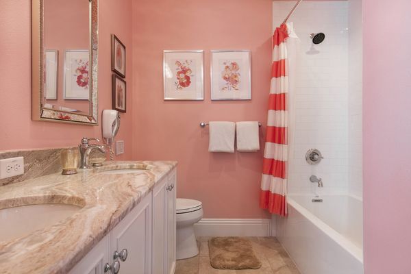 A private bathroom with dual vanity and shower for the princess bedroom