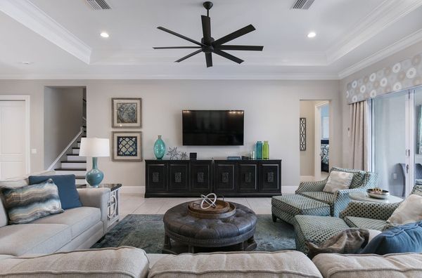 The living area features a 70-inch SMART TV