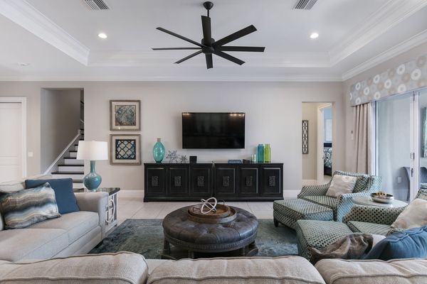 The living area features a 70-inch SMART TV