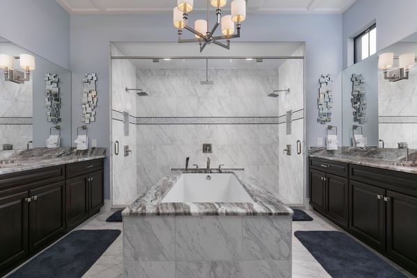 Large ensuite bathroom with amazing jacuzzi tub and glass door walk-in shower