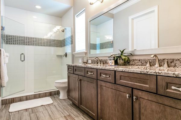 En-suite bathroom with dual vanity and a walk-in shower
