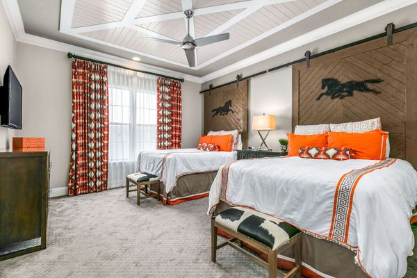 The Equestrian bedroom features two queen beds with an en-suite bathroom