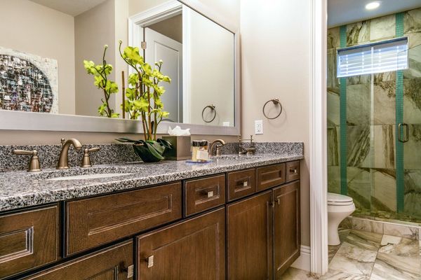 En-suite bathroom with dual vanity and walk-in shower