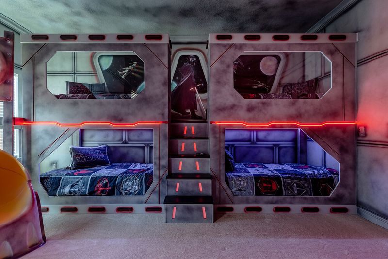 This galaxy-inspired bedroom has plenty of sleeping space for up to 8 children
