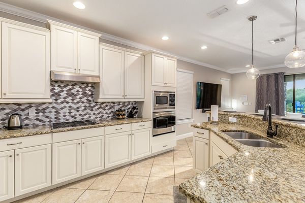 Fully equipped kitchen that features stainless steel appliances