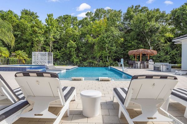 The privacy of this home is one-of-a-kind with simply nature surrounding your outdoor entertainment area and pool deck