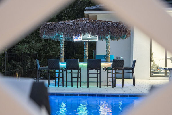 The tiki bar is a great place to cook up a BBQ, grab a drink, or watch a favorite TV show