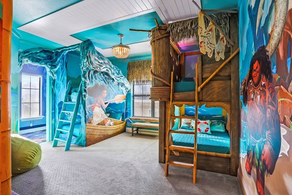 The custom kids bedroom has two sets of full/twin bunk beds