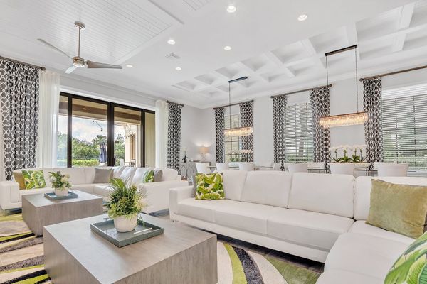 Spacious and comfortable living area with a beautiful view to the pool area