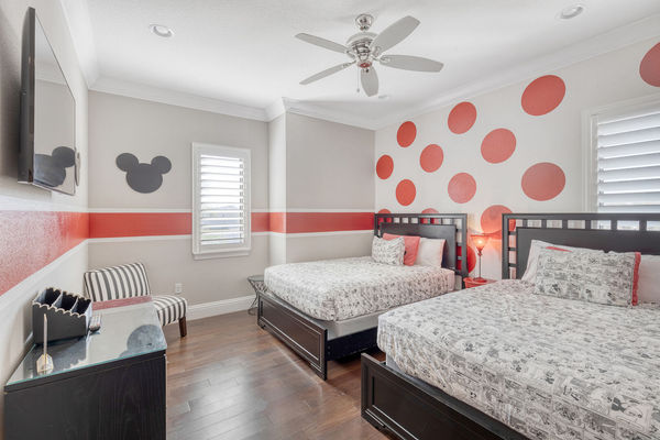 The Mickey Suite is a fun kids bedroom with two queen beds