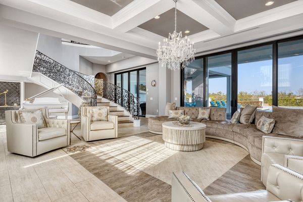 Relax in the living room area and enjoy the beautiful view toward the pool