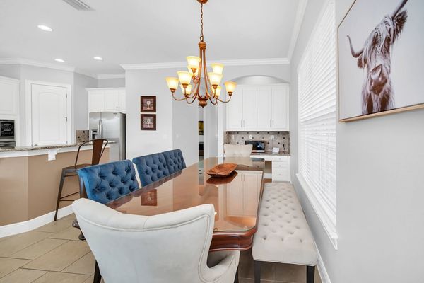 Stylish formal dining area comfortably seats eight