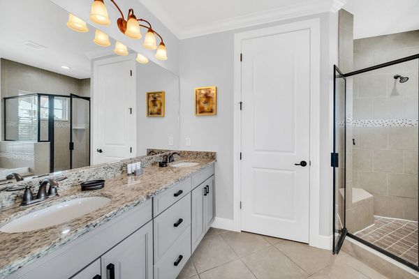 Upstairs main master bathroom with two sinks, garden tub walk-in shower