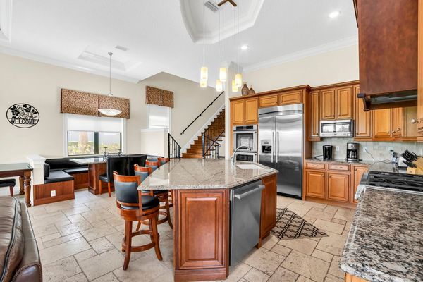 Sit at the breakfast bar and eat your breakfast in this large open kitchen