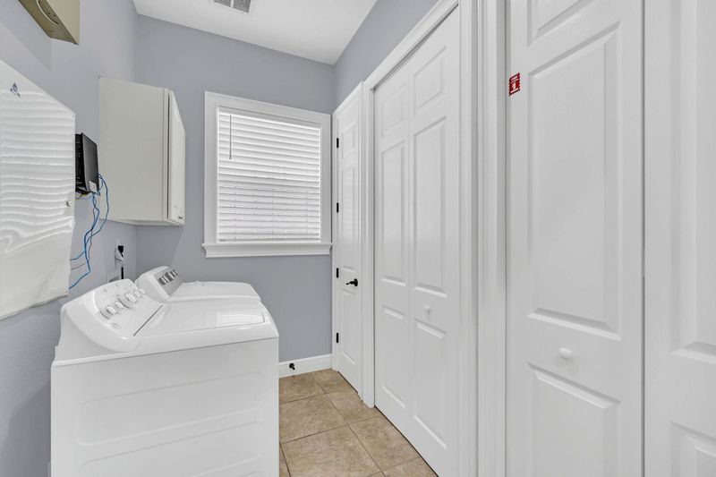 The in-unit washer and dryer located in the main house
