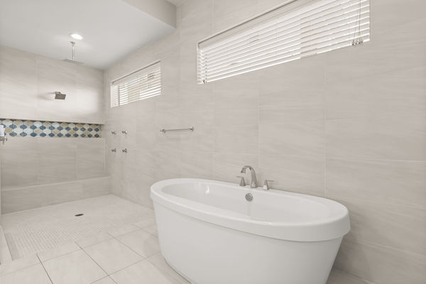 Take a shower under the rainfall showerhead or soak in your large bathtub