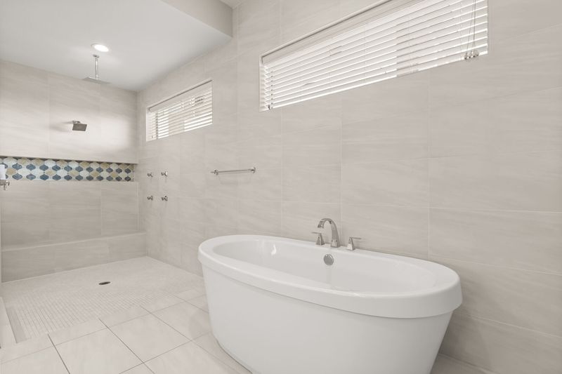 Take a shower under the rainfall showerhead or soak in your large bathtub