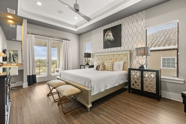 Sleep easy in this king bedroom with overhead ceiling fan and HDTV