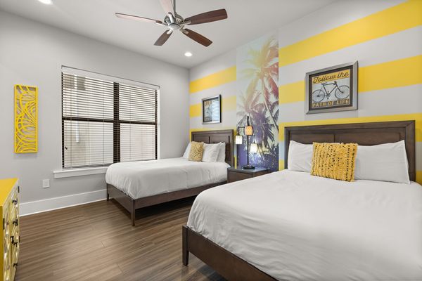 Contemporary style bedroom with two full beds