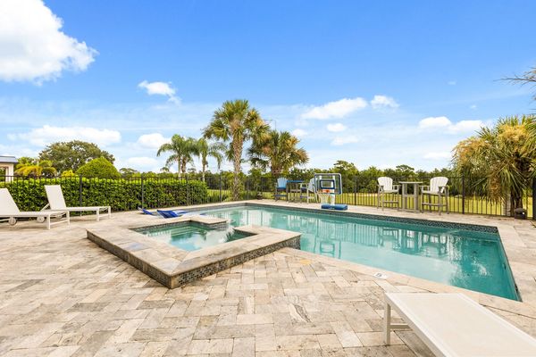 The pool overlooks the golf course