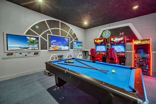 The ultimate game room with a 70-inch TV, two 50-inch TVs, Xbox One and PlayStation 4