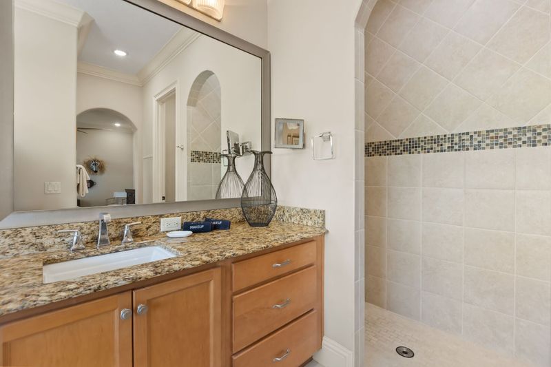 Walk into your shower or soak in the large bathtub
